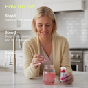 Woman using a tablet to dissolve in water in a kitchen setting